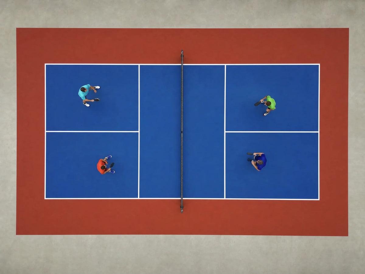 Vista cenital de una pista de pickleball portátil azul y roja